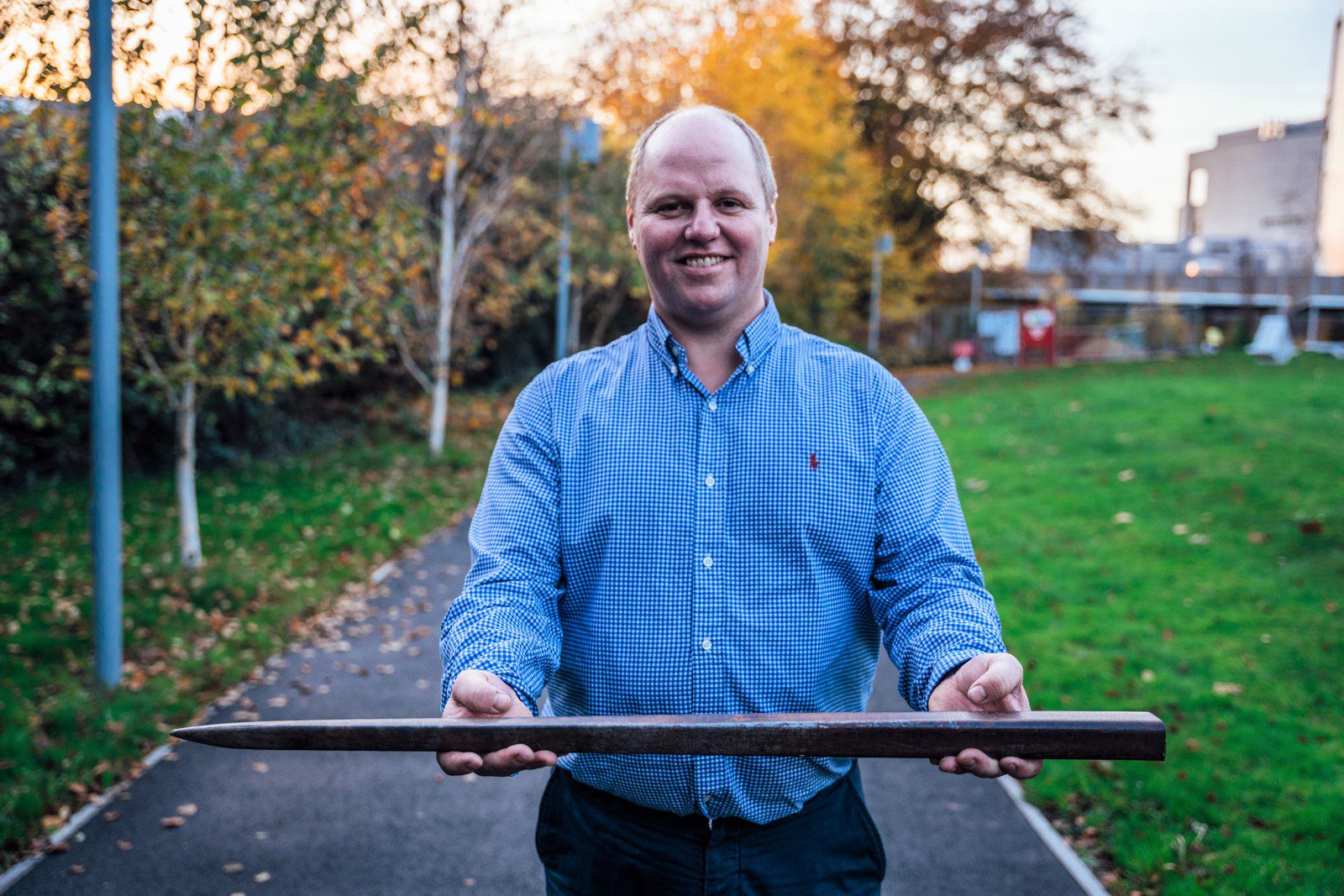 Jonathan Willis holding the forklift tine he was impaled on.