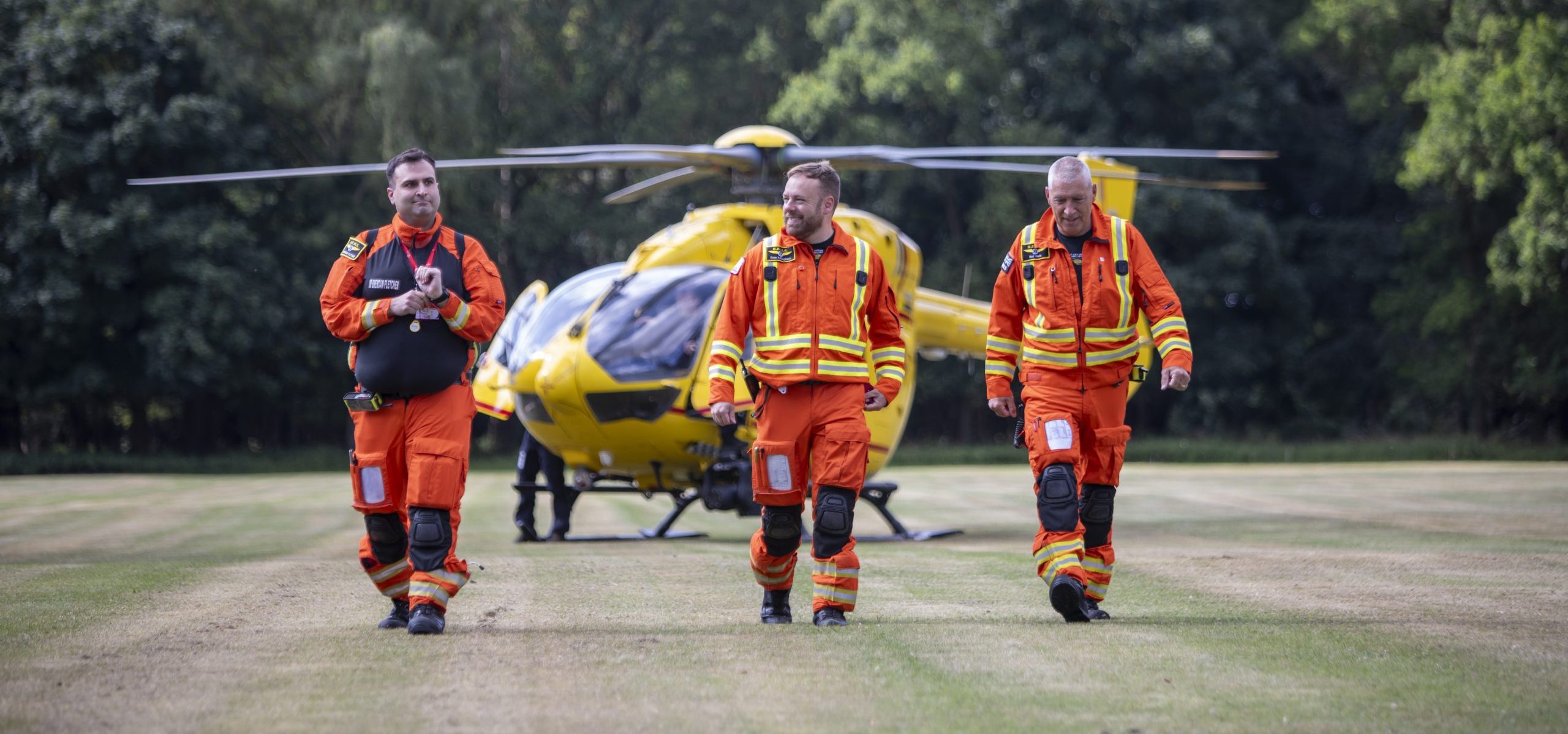 crew-walking-away-from-helicopter-scaled